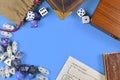 Flat lay concept design for tabletop role playing with blue and white RPG dices, character sheet and rule books Royalty Free Stock Photo