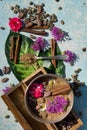 Flat lay concept with raw cocoa and coffee beans , cocoa powder,twig of cinnamon, leaf and flower as ingredien for recipe on