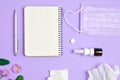 Flat lay concept of seasonal spring and summer pollen allergy with napkins, pills, face mask, pen, notepad, drops bottle. Royalty Free Stock Photo