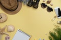 Flat lay concept of travel accessories vacation trip and long summer weekend planning on yellow table with blank space for text Royalty Free Stock Photo