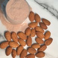 Flat lay conceptual image of protien powder and almonds Royalty Free Stock Photo