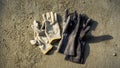 Flat lay of construction rubber and white hand glove on grunge cement background