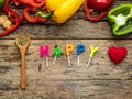 Flat lay of cooking utensils with herbs , colorful bell pepper a