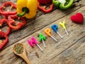 Flat lay of cooking utensils with herbs , colorful bell pepper