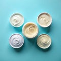 Flat Lay of Cream Samples on Light Blue Background Royalty Free Stock Photo