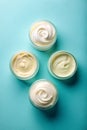 Flat Lay of Cream Samples on Light Blue Background Royalty Free Stock Photo