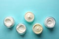 Flat Lay of Cream Samples on Light Blue Background Royalty Free Stock Photo