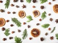 Flat lay creative natural Background of parts plants and spices. Thuja, cones, dry orange slices, spices on white background. Top