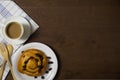 Flat lay of custard raisin danish and coffee Royalty Free Stock Photo