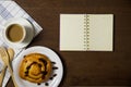 Flat lay of custard raisin danish and coffee Royalty Free Stock Photo