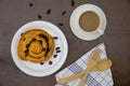 Flat lay of custard raisin danish and coffee cup Royalty Free Stock Photo