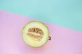 Flat lay of cut melon on blue and pink background. Royalty Free Stock Photo