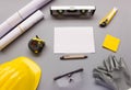 top view design engineering and construction concept on grey background with tools, white paper, safety helmet, measurement. work Royalty Free Stock Photo