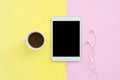 Flat lay design of travel in summer concept - Top view of an blank mock up tablet and coffee cup on pink yellow pastel color Royalty Free Stock Photo