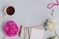 Flat lay desk with pink peony, cosmetics and accessories Royalty Free Stock Photo