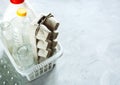 Flat lay of different wastes ready for recycling in white basket. Plastic, glass, paper. Social responsibility, ecology care Royalty Free Stock Photo