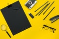 Flat lay display of business office gadgets with notepad, vintage camera, pen, develop, glasses and etc. Top view. Black Royalty Free Stock Photo