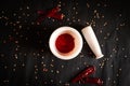 Crushed chili powder in mortar with pestle and dried red chilies isolated on black background. Royalty Free Stock Photo