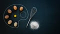 Flat lay of eggs flour and whisk eggs arranged in shape of painting palette food is art concept Royalty Free Stock Photo