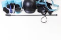 Flat lay of equestrian gear: helmet, brushes, whip, bandages, stirrups, pads, dressage, bridle. Royalty Free Stock Photo