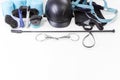 Flat lay of equestrian gear: helmet, brushes, whip, bandages, stirrups, pads, dressage, bridle Royalty Free Stock Photo