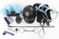 Flat lay of equestrian gear: helmet, brushes, whip, bandages, stirrups, pads, dressage, bridle. Royalty Free Stock Photo