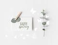 flat lay with eucalyptus and paper with HAPPY SPRING lettering Royalty Free Stock Photo