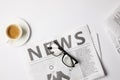 flat lay with eyeglasses, cup of coffee and newspapers, on white table Royalty Free Stock Photo