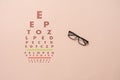 a flat lay of the eyesight chart test, otical view check with glasses