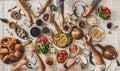 Flat-lay family having traditional Turkish breakfast over chekered tablecloth Royalty Free Stock Photo