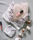 Female fashion background with lingerie, lipstick and flowers. Flat lay, top view. Beauty concept for blog, social media, magazine Royalty Free Stock Photo