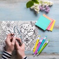 Flat lay, female coloring adult coloring book