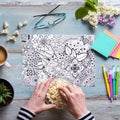 Flat lay, female coloring adult coloring book