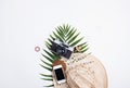 Flat lay feminine travel concept with palm leaf. Royalty Free Stock Photo