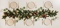 Flat-lay of Christmas table setting with white dinnerware and branches Royalty Free Stock Photo