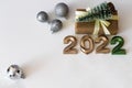 Flat lay festive new year light background with place for text, craft gifts and christmas tree, numbers 2022 Royalty Free Stock Photo