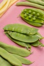 Flat lay food concept with fresh legumes, green ripe bread bean