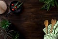 Flat lay food tomatoes and herbs on top of a dark wooden table and wooden shovels Royalty Free Stock Photo