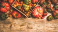 Flat -lay of fresh colorful tomatoes over wooden background Royalty Free Stock Photo