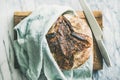 Freshly baked sourdough bread on chopping board Royalty Free Stock Photo