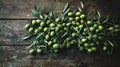 A flat lay of freshly picked olives on a rustic wooden surface Royalty Free Stock Photo