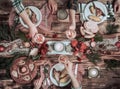 Flat-lay of friends hands eating and drinking together. Top view of people having party, gathering, celebrating together at wooden