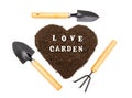 Flat-lay of garden hand tools and a heart shaped pile of soil with lettering LOVE GARDEN isolated on white Royalty Free Stock Photo
