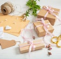 Flat lay of gift boxes and invitations on a white wooden tabletop Royalty Free Stock Photo