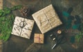 Flat-lay of gift boxes, rope, fur branches, scissors, cones, stickers Royalty Free Stock Photo