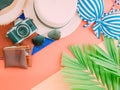 Flat lay of girl summer cloth accessorie with palm leaf , camera Royalty Free Stock Photo