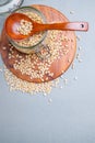 Flat lay. Glass jar with Siberian cedar nuts standing on a wooden stand