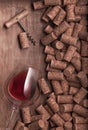 Flat Lay of glasses with red wine, corkscrew and lot of corks on wooden background Wine poster concept mockup Royalty Free Stock Photo