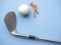 Flat lay of golf equipments on blue background - sport and hobby concept Royalty Free Stock Photo