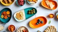 A flat lay of gourmet snacks and vibrant serving platters on a marble surface. digital Royalty Free Stock Photo